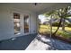 Enclosed lanai offering scenic views of the backyard and lush landscaping at 1675 Blue Lake Cir, Punta Gorda, FL 33983