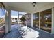 Enclosed lanai with ceiling fan, sliding glass doors and views of the well-manicured backyard at 1675 Blue Lake Cir, Punta Gorda, FL 33983