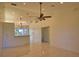 Bright living room with tile flooring, ceiling fans, and view of the backyard at 1675 Blue Lake Cir, Punta Gorda, FL 33983