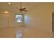 Bright living room with tile flooring, front door and large windows at 1675 Blue Lake Cir, Punta Gorda, FL 33983