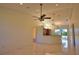 Bright living room with tile flooring, recessed lighting, ceiling fans, and access to other rooms at 1675 Blue Lake Cir, Punta Gorda, FL 33983