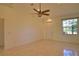 Bright living room with tile flooring, a front door and a large window at 1675 Blue Lake Cir, Punta Gorda, FL 33983