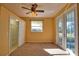 Inviting main bedroom with walk-in closet, natural light, and outdoor access at 1675 Blue Lake Cir, Punta Gorda, FL 33983