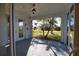 Enclosed patio with outdoor access and ceiling fans to create a cool and inviting ambiance. Screen provides shade at 1675 Blue Lake Cir, Punta Gorda, FL 33983