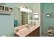 Bathroom featuring a vanity with ample counter space, a mirrored medicine cabinet, and natural light at 2153 Boxwood St, North Port, FL 34289