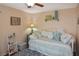 Cozy bedroom with a daybed, soft lighting, and beach-themed decor at 2153 Boxwood St, North Port, FL 34289