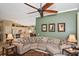 Comfortable living room with a large sectional sofa and seamless flow into the kitchen at 2153 Boxwood St, North Port, FL 34289