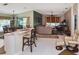 Open-concept living area features tiled flooring and a seamless flow into the living room and dining area at 2153 Boxwood St, North Port, FL 34289
