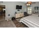 Spacious main bedroom with modern decor, ceiling fan, and en-suite bathroom access at 2153 Boxwood St, North Port, FL 34289