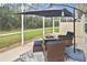 Relaxing screened-in patio with outdoor seating and a view of the lush backyard at 2153 Boxwood St, North Port, FL 34289