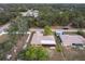Aerial view of a home surrounded by lush trees and foliage in a tranquil neighborhood at 2281 Tolbert St, Port Charlotte, FL 33948