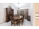 Elegant dining room with chandelier lighting, tile floors, and wooden furniture set at 2281 Tolbert St, Port Charlotte, FL 33948