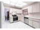 Well-lit kitchen with stainless steel appliances and light wood cabinetry at 2281 Tolbert St, Port Charlotte, FL 33948