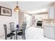 Kitchen with dining table, stainless steel appliances, and ample storage at 2281 Tolbert St, Port Charlotte, FL 33948