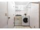 Laundry room featuring a washer, dryer and shelving at 2281 Tolbert St, Port Charlotte, FL 33948