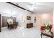 Inviting living room area with tile flooring, ceiling fan, and decorative architectural features at 2281 Tolbert St, Port Charlotte, FL 33948