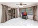 Living room featuring tiled floors, a ceiling fan, and sliding glass doors at 2281 Tolbert St, Port Charlotte, FL 33948