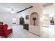 Bright living room showcasing tile flooring, a ceiling fan, and decorative architectural features at 2281 Tolbert St, Port Charlotte, FL 33948