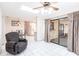 Open floor plan living room with tile floors, ceiling fan and access to patio at 2281 Tolbert St, Port Charlotte, FL 33948