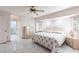Spacious main bedroom features tiled floors, a ceiling fan, and neutral decor at 2281 Tolbert St, Port Charlotte, FL 33948