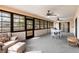 Cozy sunroom with ample seating and natural light, perfect for relaxing or entertaining at 2281 Tolbert St, Port Charlotte, FL 33948