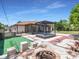 Backyard showing deck, pergola, and room to relax outdoors at 23227 Adela Ave, Port Charlotte, FL 33952