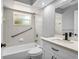 Clean bathroom featuring a tub and shower combination, complemented by modern fixtures and a vanity at 23227 Adela Ave, Port Charlotte, FL 33952