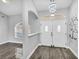 Inviting entryway with stylish double doors, glossy floors, and modern light fixtures at 23227 Adela Ave, Port Charlotte, FL 33952