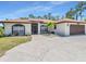Charming one-story home with a well-maintained lawn and a two-car garage in a desirable neighborhood at 23227 Adela Ave, Port Charlotte, FL 33952