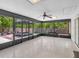 Relaxing sunroom with views of the outdoor deck and backyard, perfect for year-round enjoyment at 23227 Adela Ave, Port Charlotte, FL 33952