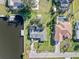 Aerial view of a single-Gathering home with a private boat dock and lush green lawn at 3000 Wisteria Pl, Punta Gorda, FL 33950