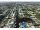 Expansive aerial view of waterfront homes lining canals in a well-maintained residential community at 3000 Wisteria Pl, Punta Gorda, FL 33950