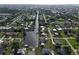 Extensive aerial view of waterfront homes along a canal in a well-populated neighborhood at 3000 Wisteria Pl, Punta Gorda, FL 33950