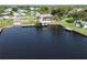 Waterfront home with a dock, a boat lift, and a beautiful view of the surrounding area at 3000 Wisteria Pl, Punta Gorda, FL 33950