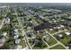 An aerial view of a quiet residential neighborhood featuring lush landscaping and a winding waterway at 3000 Wisteria Pl, Punta Gorda, FL 33950