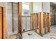 Stripped bathroom with exposed cinder block and wooden supports, awaiting renovation and design at 3000 Wisteria Pl, Punta Gorda, FL 33950