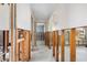 Long hallway awaiting renovation, offering a look into adjacent rooms and potential design opportunities at 3000 Wisteria Pl, Punta Gorda, FL 33950