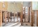 View of the gutted interior showcasing the exposed framework and some remaining decorative wallpaper at 3000 Wisteria Pl, Punta Gorda, FL 33950
