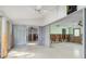Bright living area with sliding glass doors and a ceiling fan, ready for renovation and customization at 3000 Wisteria Pl, Punta Gorda, FL 33950