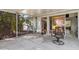 Enclosed back patio with lush greenery just outside the screen, offering privacy and shade at 3000 Wisteria Pl, Punta Gorda, FL 33950