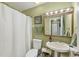 Bathroom featuring a shower, sink, and vanity with bright lighting at 9158 Snapper Cir, Port Charlotte, FL 33981