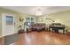 Inviting living room with laminate flooring, comfortable seating, and abundant natural light streaming through the windows at 9158 Snapper Cir, Port Charlotte, FL 33981