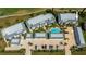 Aerial view of condo complex with pool, parking, and well-maintained landscaping at 1340 San Cristobal Ave # 305, Punta Gorda, FL 33983