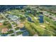 An aerial view of a golf course community with ponds and lush landscaping at 1340 San Cristobal Ave # 305, Punta Gorda, FL 33983