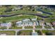 Aerial view of condo complex next to golf course and waterways in a residential neighborhood at 1340 San Cristobal Ave # 305, Punta Gorda, FL 33983