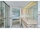 Bright bathroom features marble counters, tile floor, vanity, and access to the main bedroom at 1340 San Cristobal Ave # 305, Punta Gorda, FL 33983
