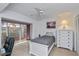 Serene bedroom featuring a twin bed, a large window, and a white dresser at 1340 San Cristobal Ave # 305, Punta Gorda, FL 33983