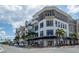 Contemporary building exterior featuring multiple floors, balconies, and ground-level commercial spaces at 1340 San Cristobal Ave # 305, Punta Gorda, FL 33983