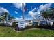 Fairway Pines community sign with palm trees and well-maintained landscaping at 1340 San Cristobal Ave # 305, Punta Gorda, FL 33983