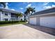 Exterior view of the condo buildings with a driveway and two car garages at 1340 San Cristobal Ave # 305, Punta Gorda, FL 33983